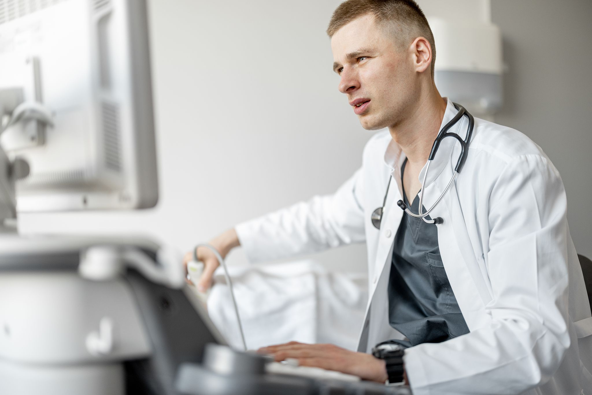 ultrasound-specialist-examining-lower-abdomen-of-m-2026-01-08-22-17-27-utc 1