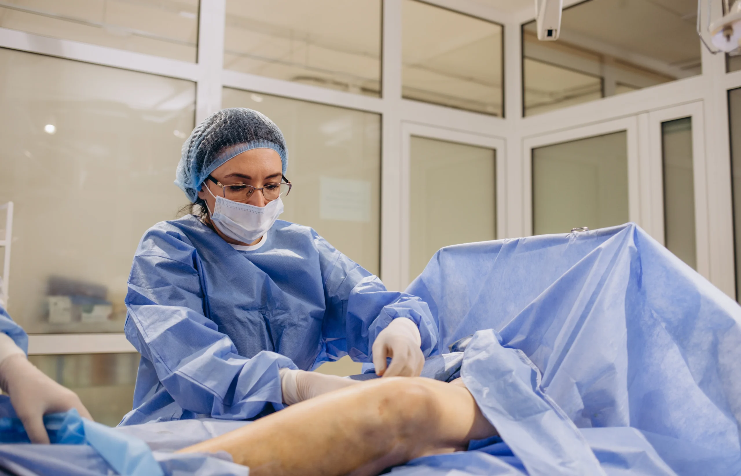 surgeon-preparing-patient-for-surgery-in-hospital